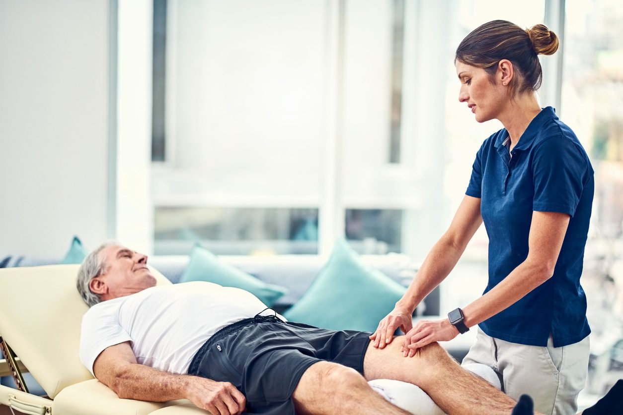 Senior patient receiving knee physiotherapy at PhysioPath clinic Bangalore